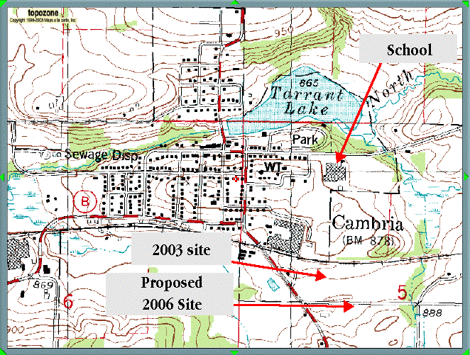 This is an image of a 1990 topographic map with a marker indicating the location of the proposed Didion ethanol plant. The plant is to be located in the southeast corner of the Village. Virtually no point in the Village is more than a half mile away from the plant. Most areas of the Village including the school, are much closer. On a topographic map, one can see more clearly that the proposed plant is in a valley which serves as a watershed for the area.